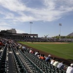Fans watch as the San Francisco Giants play a spring training baseball game against the Los Angeles Dodgers at Scottsdale Stadium in Scottsdale, Ariz., Thursday, Feb. 26, 2009. (AP Photo/Eric Risberg)