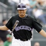 Colorado Rockies starting pitcher Jorge De La Rosa tosses his bat after striking out to end the second inning against Mexico Thursday, March 5, 2009, during an exhibition spring baseball game in Tucson, Ariz. (AP Photo/Elaine Thompson)