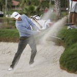 Heath Slocum hits out of the sand trap onto the eighth green during the first round of the Honda Classic golf tournament in Palm Beach Gardens, Fla. Thursday, March 5, 2009. (AP Photo/J Pat Carter)