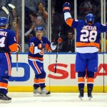 New York Islanders' Jeff Tambellini (15) celebrates scoring his goal in the second period of an NHL hockey game against the Phoenix Coyotes Sunday, March 8, 2009 in Uniondale, N.Y. (AP Photo/Paul J. Bereswill)