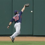 Cleveland Indians' David Dellucci can't catch a double by Oakland Athletics' Matt Holliday during the fifth inning of a spring training baseball game in Phoenix on Sunday, March 8, 2009. (AP Photo/Jeff Chiu)
