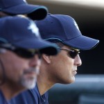 Seattle Mariners manager Don Wakamatsu, right, watches during the sixth inning of a spring training baseball game against the Texas Rangers, Sunday, March 1, 2009, in Surprise, Ariz. Seattle won the game 13-6. (AP Photo/Charlie Riedel)