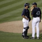 Seattle Mariners pitcher Miguel Batista (43) talks with catcher Jeff Clement during the third inning of an exhibition spring baseball game against Australia on Wednesday, March 4, 2009, in Peoria, Ariz. (AP Photo/Charlie Riedel)