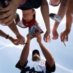 Cleveland Indians' Travis Hafner signs autographs prior to the Indians spring training baseball game against the Milwaukee Brewers, Friday, March 6, 2009, in Goodyear, Ariz. (AP Photo/Ross D. Franklin)