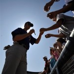 Chicago Cubs right fielder Doug Deeds signs autographs before their spring training baseball game with the Milwaukee Brewers in Maryvale, Az., Saturday, March 7, 2009. (AP Photo/Chris Carlson)