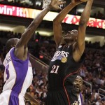 Philadelphia 76ers' Thaddeus Young (21) goes up to score as Phoenix Suns' Jason Richardson, left, and Shaquille O'Neal, back, move in late to defend in the first quarter of an NBA basketball game Wednesday, March 18, 2009, in Phoenix. (AP Photo/Ross D. Franklin)