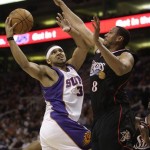 Phoenix Suns' Jared Dudley (3) scores against the Philadelphia 76ers' Donyell Marshall (8) in the fourth quarter of an NBA basketball game Wednesday, March 18, 2009, in Phoenix. The Suns defeated the 76ers 126-116. (AP Photo/Ross D. Franklin)