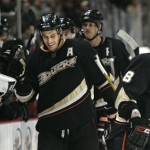 The Anaheim Ducks' Ryan Getzlaf, left, is congratulated by teammates after scoring his second goal in an NHL game against the Phoenix Coyotes in Anaheim, Calif., on Sunday, March 22, 2009. (AP Photo/Branimir Kvartuc)
