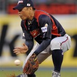 Japan second baseman Akinori Iwamura fields a grounder by South Korea's Kim Hyun-soo in the first inning of the championship game of the World Baseball Classic on Monday, March 23, 2009, in Los Angeles. (AP Photo/Mark J. Terrill)
