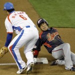 South Korea third baseman Lee Bum-ho takes in the late throw as Japan's Hiroyuki Nakajima slides in safely in the fifth inning of the championship game of the World Baseball Classic Monday, March 23, 2009, in Los Angeles. (AP Photo/Ted S. Warren)