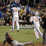 Japan's Norichika Aoki (23) looks up as South Korea pitcher Jong Hyun-wook celebrates after Aoki was tagged out by South Korea's Park Ki-hyuk (16) after missing the bag on a stolen-base attempt during the fifth inning of the final of the World Baseball Classic in Los Angeles, Monday, March 23, 2009. Second base umpire Ron Kulpa watches the play. (AP Photo/Matt Sayles)