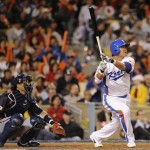 South Korea's Choo Shin-soo watches his home run as Japan catcher Kenji Johjima watches at left during the fifth inning of the final of the World Baseball Classic in Los Angeles, Monday, March 23, 2009. (AP Photo/Mark J. Terrill)
