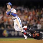 Japan's Hiroyuki Nakajima, right, is forced out at second as South Korea's Ko Young Min turns a double play during the seventh inning of the final of the World Baseball Classic in Los Angeles, Monday, March 23, 2009. (AP Photo/Mark J. Terrill)