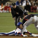 South Korea's Lee Yong-kyu, left, is tagged out by Japan's Hiroyuki Nakajima while trying to steal during the sixth inning of the championship game of the World Baseball Classic Monday, March 23, 2009, in Los Angeles. (AP Photo/Matt Sayles)
