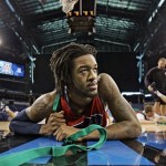Arizona's Jordan Hill stretches before practice at the NCAA Midwest Regional men's college basketball tournament Thursday, March 26, 2009, in Indianapolis. Arizona plays Louisville in a regional semifinal on Friday. (AP Photo/Darron Cummings)