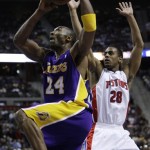 Los Angeles Lakers guard Kobe Bryant, left, drives past Detroit Pistons guard Arron Afflalo in the first quarter of an NBA basketball game in Auburn Hills, Thursday, March 26, 2009. (AP Photo/Paul Sancya)