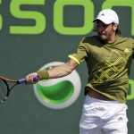 Nicolas Massu, of Chile, returns the ball to Ryan Sweeting of the United States, in the first round at the Sony Ericsson Open tennis tournament in Key Biscayne, Fla. Thursday, March 26, 2009. (AP Photo/Lynne Sladky)