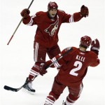 Phoenix Coyotes' Ed Jovanovski, top, celebrates the goal of teammate Ken Klee (2) against the Edmonton Oilers in the second period of an NHL hockey game in Glendale, Ariz., Thursday, March 26, 2009. The goal put the Coyotes up 2-0. (AP Photo/Aaron J. Latham)