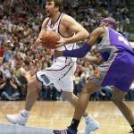 Utah Jazz's Mehmet Okur, left, is held as he drives to the basket by Phoenix Suns' Stromile Swift in the second half of an NBA basketball game in Salt Lake City, Saturday, March 28, 2009. The Jazz beat the Sun's 104-99 in overtime. (AP Photo/George Frey)