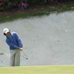 Rory McIlroy of Northern Ireland chips onto the thirteen green during his practice round for the Masters golf tournament at the Augusta National Golf Club in Augusta, Ga., Monday, April 6, 2009. (AP Photo/Charlie Riedel)