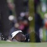 Vijay Singh of Fiji hits out of the chipping green while practicing for the Masters golf tournament at the Augusta National Golf Club in Augusta, Ga., Monday, April 6, 2009. (AP Photo/Rob Carr)