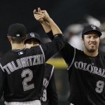 Colorado Rockies' Ian Stewart (9) gets a high-five from teammate Troy Tulowitzki (2) after the Rockies defeated the Arizona Diamondbacks in a baseball game Wednesday, April 8, 2009, in Phoenix. Stewart had a pinch-hit home run iin the Rockies 9-2 win. (AP Photo/Ross D. Franklin)