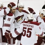 Phoenix Coyotes left wing Scottie Upshall, third from left, is embrace by teammates after scoring against the San Jose Sharks during the first period of an NHL hockey game in San Jose, Calif. Thursday, April 9, 2009. (AP Photo/Marcio Jose Sanchez)