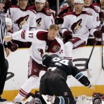 Phoenix Coyotes left wing Todd Fedoruk, top, fights with San Jose Sharks Left Wing Travis Moen during the second period of an NHL hockey game in San Jose, Calif. Thursday, April 9, 2009. (AP Photo/Marcio Jose Sanchez)