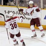 Phoenix Coyotes center Peter Mueller, top, celebrates with teammate Joakim Lindstrom, of Sweden, after Mueller's goal during the third period of an NHL hockey game in San Jose, Calif. Thursday, April 9, 2009. Phoenix won 4-1. (AP Photo/Marcio Jose Sanchez)