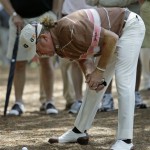 Miguel Angel Jimenez of Spain examines his ball closely in the rough off of the first fairway during the second round of the Masters golf tournament at the Augusta National Golf Club in Augusta, Ga., Friday, April 10, 2009. (AP Photo/Morry Gash)