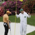 Sergio Garcia of Spain discusses his putt with his caddie Glen Murray on the 13th green during the second round of the Masters golf tournament at the Augusta National Golf Club in Augusta, Ga., Friday, April 10, 2009. (AP Photo/David J. Phillip)