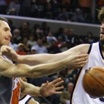 Phoenix Suns guard Steve Nash, left, passes the ball past Memphis Grizzlies Marc Gasol, right, of Spain, in the first half of an NBA basketball game Friday, April 10, 2009, in Memphis, Tenn. (AP Photo/Lance Murphey)
