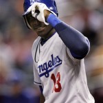 Los Angeles Dodgers second baseman Orlando Hudson tips his helmet to his former teammates in the Arizona Diamondbacks' dugout as he steps in to bat in the first inning of a baseball game Friday, April 10, 2009, in Phoenix. (AP Photo/Paul Connors)