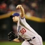 Los Angeles Dodgers pitcher Eric Stults delivers a pitch against the Arizona Diamondbacks during the first inning of a baseball game Saturday, April 11, 2009 in Phoenix. (AP Photo/Matt York)