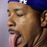 Los Angeles Dodgers' Manny Ramirez makes faces in the dugout against the Arizona Diamondbacks during the sixth inning of a baseball game Saturday, April 11, 2009 in Phoenix. (AP Photo/Matt York)