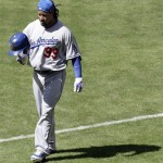 Los Angeles Dodgers' Manny Ramirez tosses his helmet as he walks back to the dugout after grounding out against the Arizona Diamondbacks in the sixth inning of a baseball game Sunday, April 12, 2009, in Phoenix. (AP Photo/Paul Connors)
