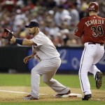 Arizona Diamondbacks' Max Scherzer (39) gets thrown out at first base as St. Louis Cardinals' Albert Pujols, of the Dominican Republic, gets ready to catch the ball in the second inning in a baseball game Tuesday, April 14, 2009, in Phoenix. (AP Photo/Ross D. Franklin)