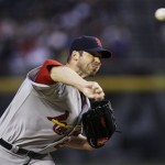 St. Louis Cardinals' Chris Carpenter throws against the Arizona Diamondbacks in the first inning of a baseball game Tuesday, April 14, 2009, in Phoenix. Carpenter left the game due to injury before pitching in the fourth inning. (AP Photo/Ross D. Franklin)
