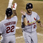 St. Louis Cardinals' Joe Thurston (22) congratulates Rick Ankiel after scoring against the Arizona Diamondbacks on a double by Yadier Molina in the fourth inning in a baseball game Tuesday, April 14, 2009, in Phoenix. (AP Photo/Ross D. Franklin)