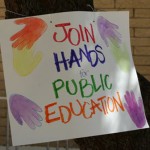 A sign made at the rally for education at Washington Park. (Jim Cross/KTAR) 