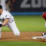 Arizona Diamondbacks' Felipe Lopez (2) steals second in the third inning of a baseball game in Miami, Monday, May 18, 2009, after Florida Marlins second baseman Dan Uggla was pulled off base. (AP Photo/J Pat Carter)