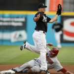 Arizona Diamondbacks' Mark Reynolds goes to second on a late throw to Florida Marlins second baseman Dan Uggla during a first-inning double steal in a baseball game in Miami, Thursday, May 21, 2009. (AP Photo/J Pat Carter)
