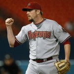Arizona Diamondbacks relief pitcher Chad Qualls pumps his fist in celebration after Arizona defeated the Florida Marlins 4-3 in a baseball game Thursday, May 21, 2009, in Miami. (AP Photo/J Pat Carter)