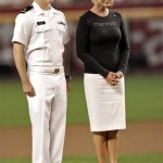 U.S. Navy Ensign John Sidney "Jack" McCain IV, and his mother, Cindy McCain, pause during a silent first pitch prior to the Arizona Diamondbacks and San Diego Padres baseball game Monday, May 25, 2009, in Phoenix. (AP Photo/Matt York)