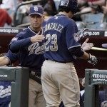 San Diego Padres manager Bud Black, left, congratulates Adrian Gonzalez, right, as Gonzalez returns to the dugout after hitting a two-run home run off Arizona Diamondbacks pitcher Billy Buckner in the first inning of a baseball game Wednesday, May 27, 2009, in Phoenix. (AP Photo/Paul Connors)