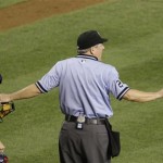 Umpire Jerry Crawford, center, separates Atlanta Braves' David Ross, left, and Arizona Diamondbacks' Justin Upton after the two exchanged words following Upton's flipping his bat away and earning a walk in the sixth inning of a baseball game, Saturday, May 30, 2009, in Phoenix. (AP Photo/Ross D. Franklin)