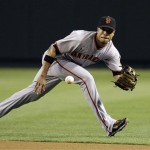 San Francisco Giants' Emmanuel Burriss gets ready to field a ground ball hit by Arizona Diamondbacks' Stephen Drew in the first inning of a baseball game Thursday, June 11, 2009, in Phoenix. (AP Photo/Ross D. Franklin)