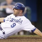 Kansas City Royals' David DeJesus (9) slides across the plate past Arizona Diamondbacks catcher Miguel Montero to score on a single hit by Willie Bloomquist during the fifth inning of a baseball game Tuesday, June 16, 2009, in Kansas City, Mo. (AP Photo/Charlie Riedel)