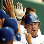 Kansas City Royals' Billy Butler is congratulated by teammates after scoring on a Jose Guillen double in the first inning of a baseball game against the Arizona Diamondbacks on Wednesday, June. 17, 2009, in Kansas City, Mo. (AP Photo/Ed Zurga)
