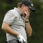 Phil Mickelson reacts to his tee shot on the 13th hole during the first round of the U.S. Open Golf Championship at Bethpage State Park's Black Course in Farmingdale, N.Y., Friday, June 19, 2009. (AP Photo/Mel Evans)